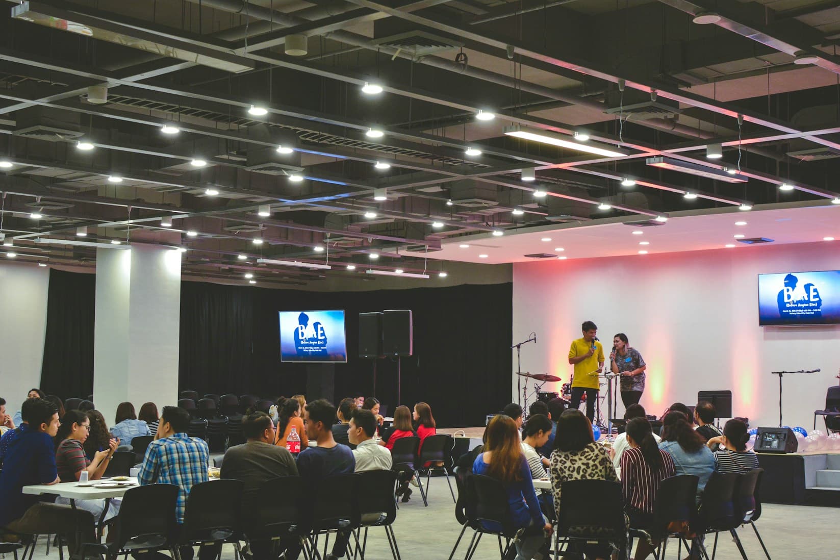 Audience seated at a networking talk and community event